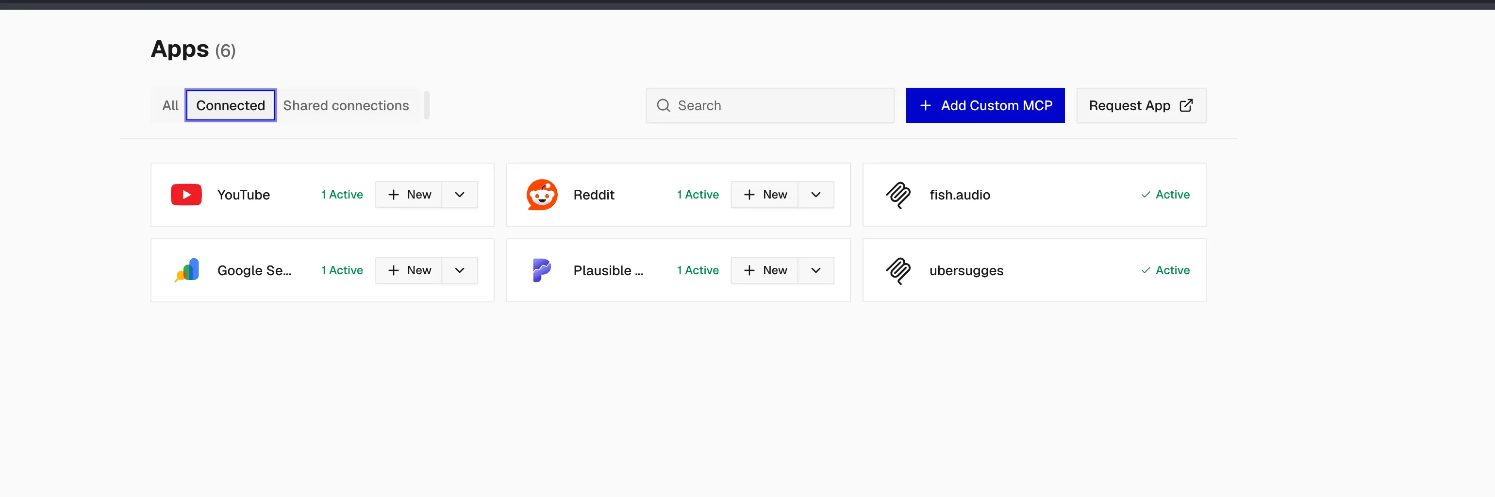 Composio Apps screen showing six connected apps: YouTube, Reddit, Google Search Console and Plausible from the catalog, plus fish.audio and ubersuggest added via Add Custom MCP